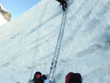Climbing one of the last ladders in the Khumbu Icefall in 2015.