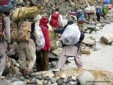 Porters in the Karakoram. Carrying gear to K2 Base Camp.
