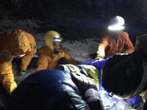 NPS Rangers working on Alan at Twin Sisters