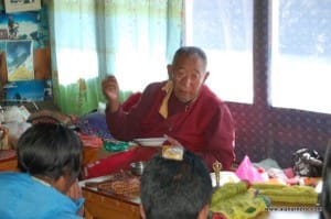 Lama Geshi providing a blessing for the Sherpas