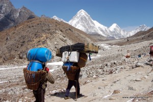 Porters carrying loads to Everest Base Camp