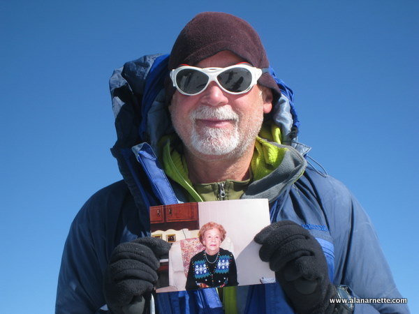 Alan holding a picture of Ida Arnette on the summit of Mt. Elbrus