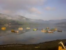 Sunrise over the Phewa Lake by Grant Rawlinson Sunrise over the Phewa Lake by Grant Rawlinson