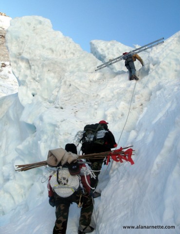 The Doctors taking ladders into the Khumbu Icefall