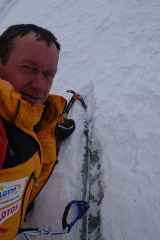 Denis Urubko chopping out old rope on K2 courtesy of russianClimb.com