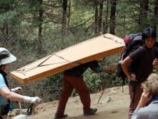 Porter carrying wood to Namche
